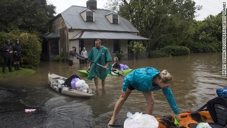 18,000 evacuated in Australia as floods worsen
